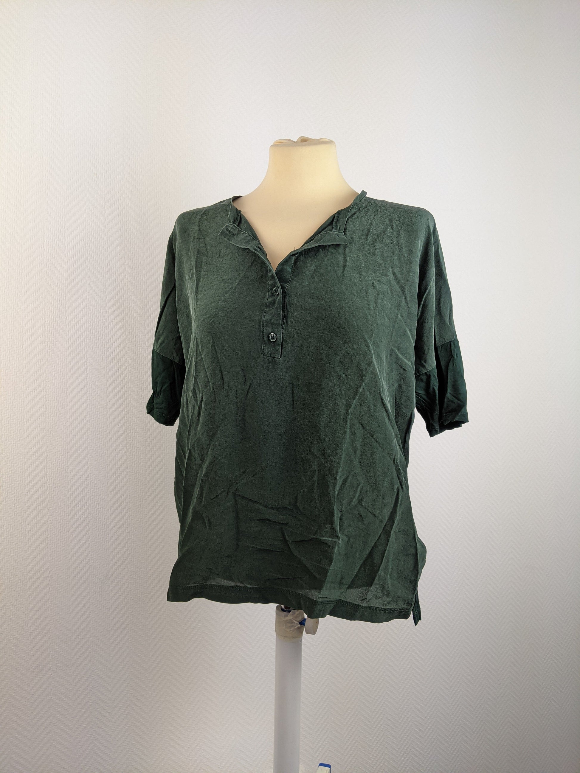 Front view of dark green blouse