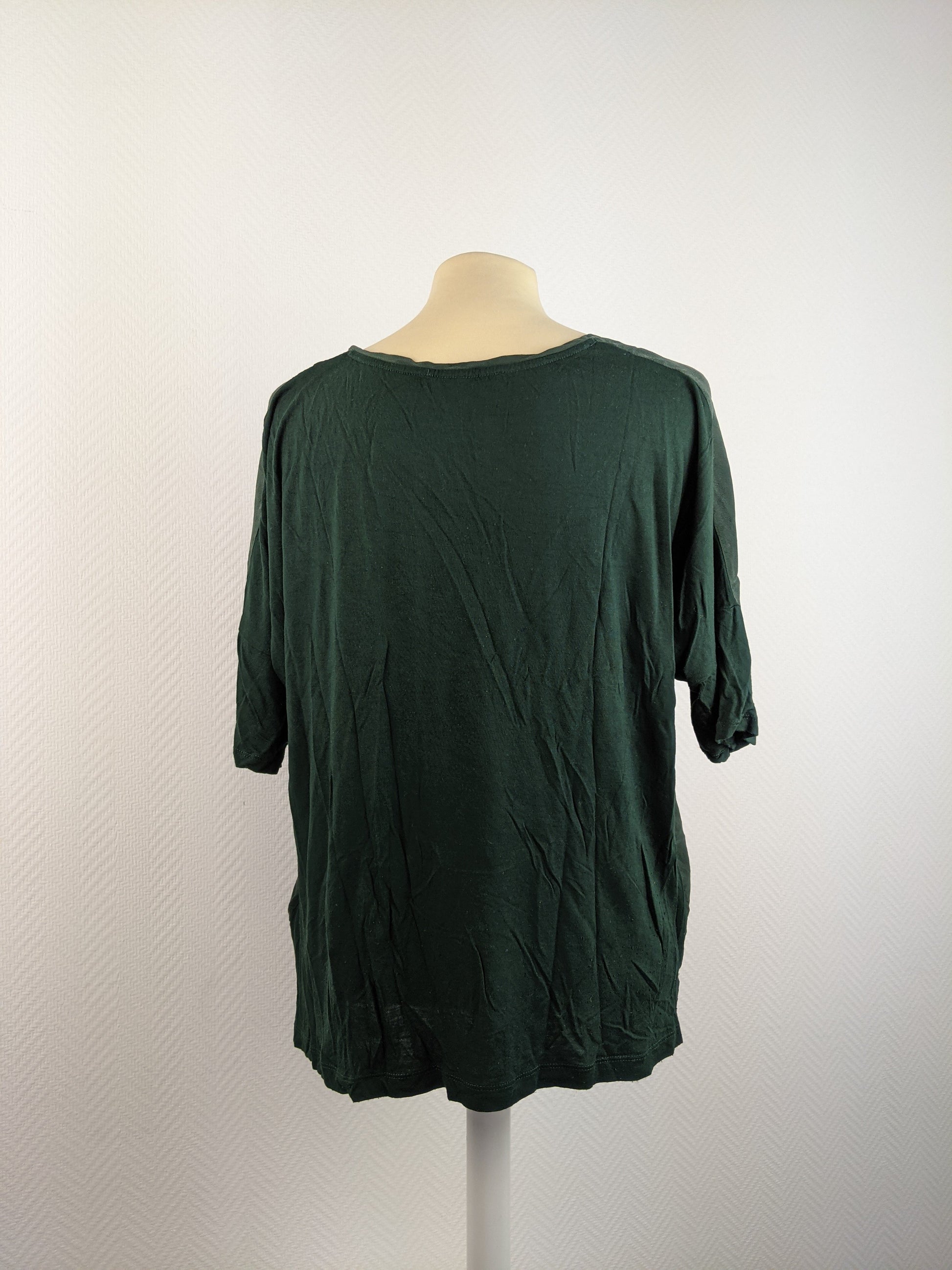 Back view of dark green blouse