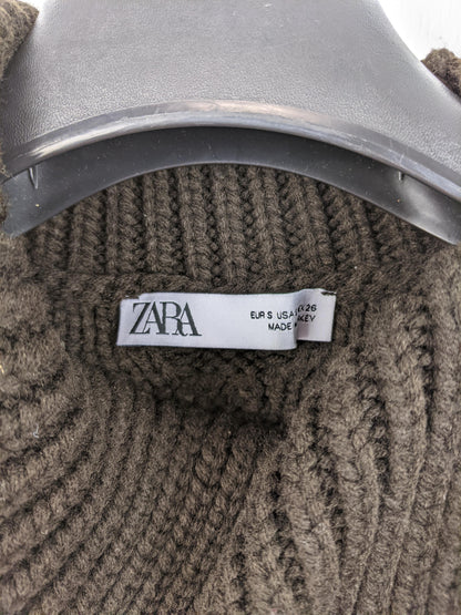 Close-up of Zara label on brown knit vest