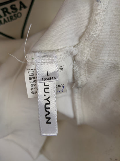 Tag showing size L and brand information