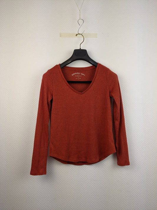 Front view of red ribbed long-sleeve top