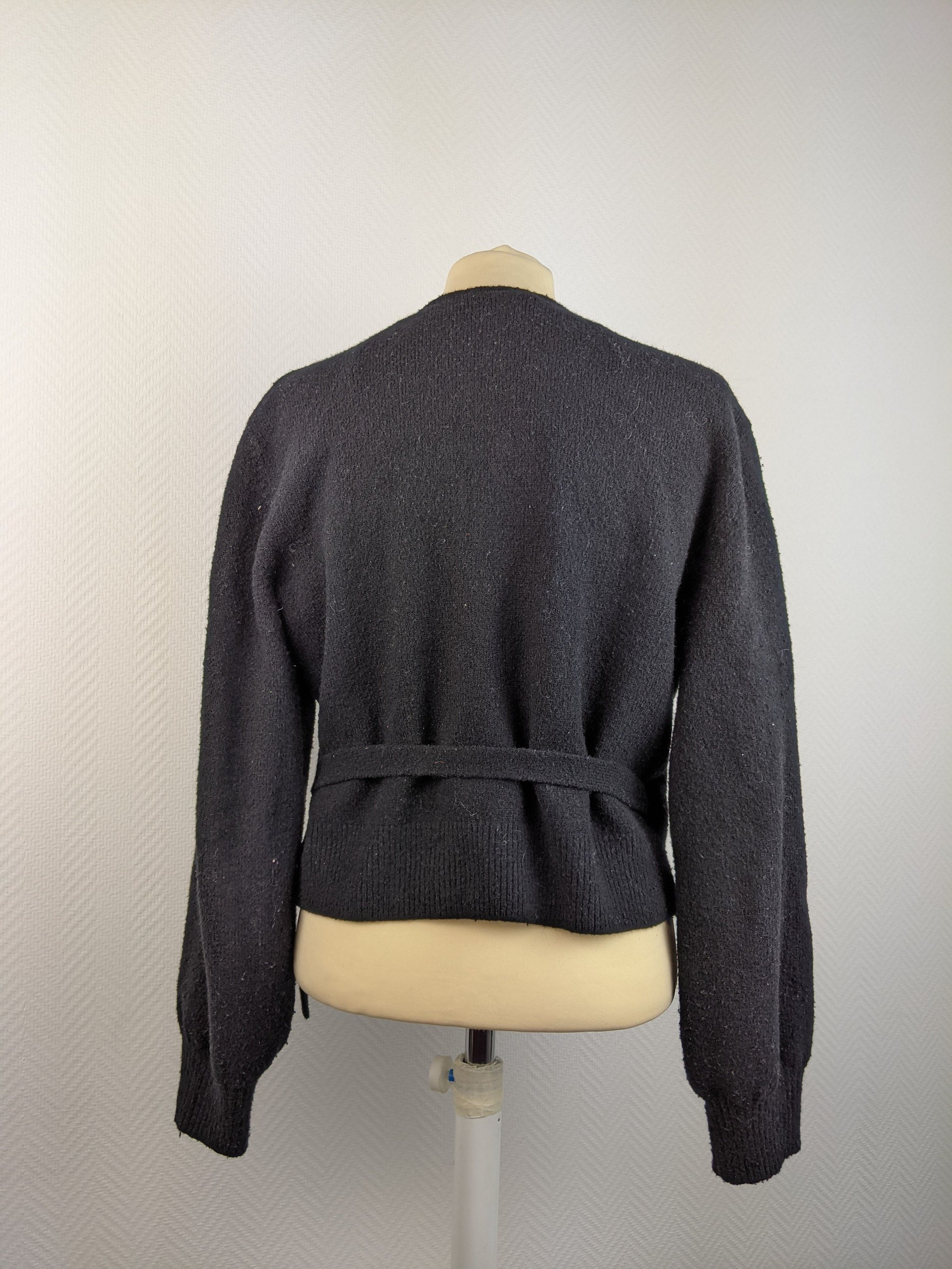 Back view of black wrap cardigan