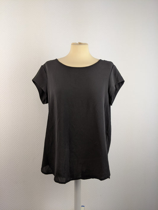 Front view of black short sleeve top on mannequin