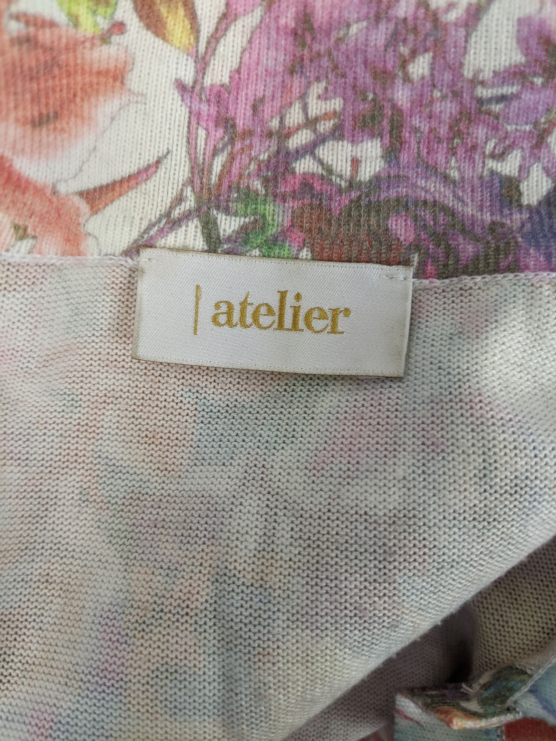 Close-up of Atelier label on floral blouse