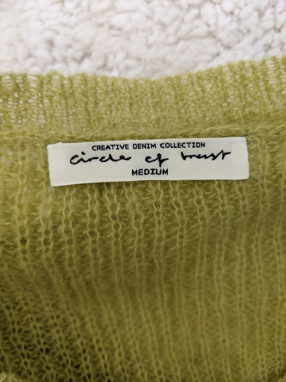 Label of the sweater showing brand and size