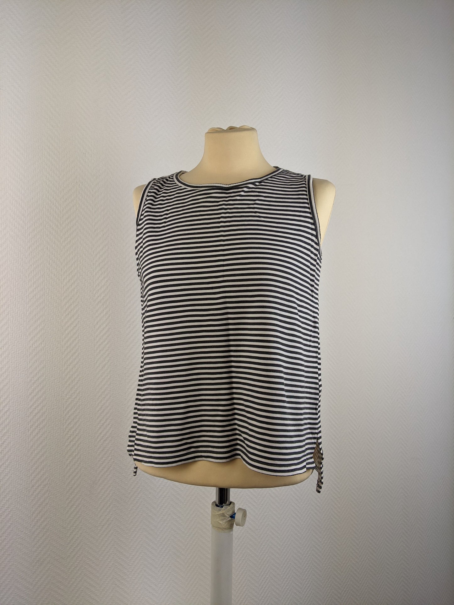 Front view of Vanilia black striped sleeveless top
