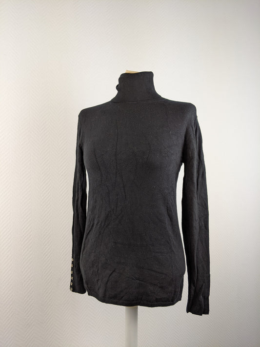 Front view of black turtleneck sweater