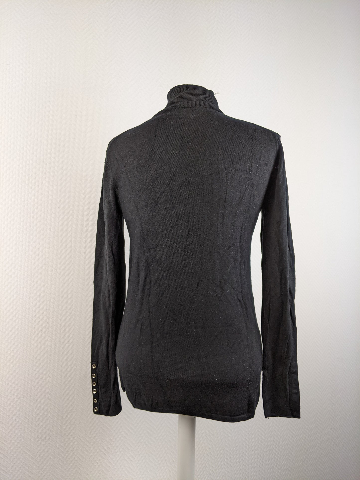 Back view of black turtleneck sweater