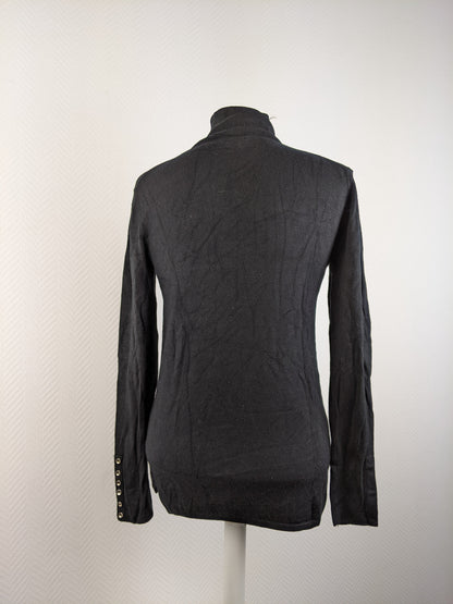 Back view of black turtleneck sweater