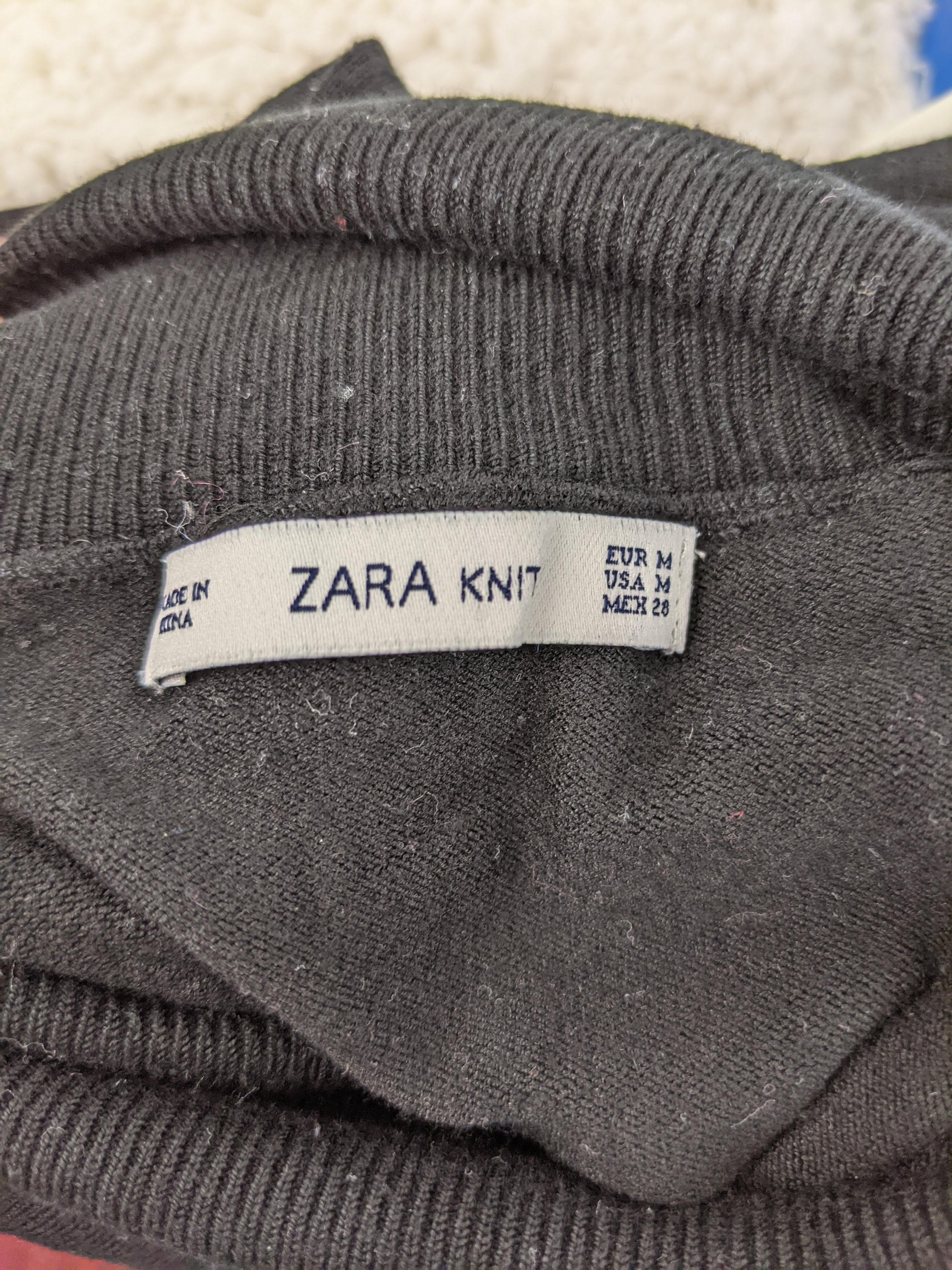 Zara knit label in sweater