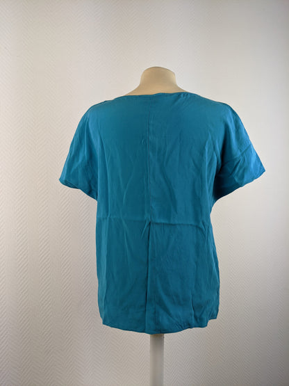 Back view of Vanilia Caribbean Sea Blue Silk Top
