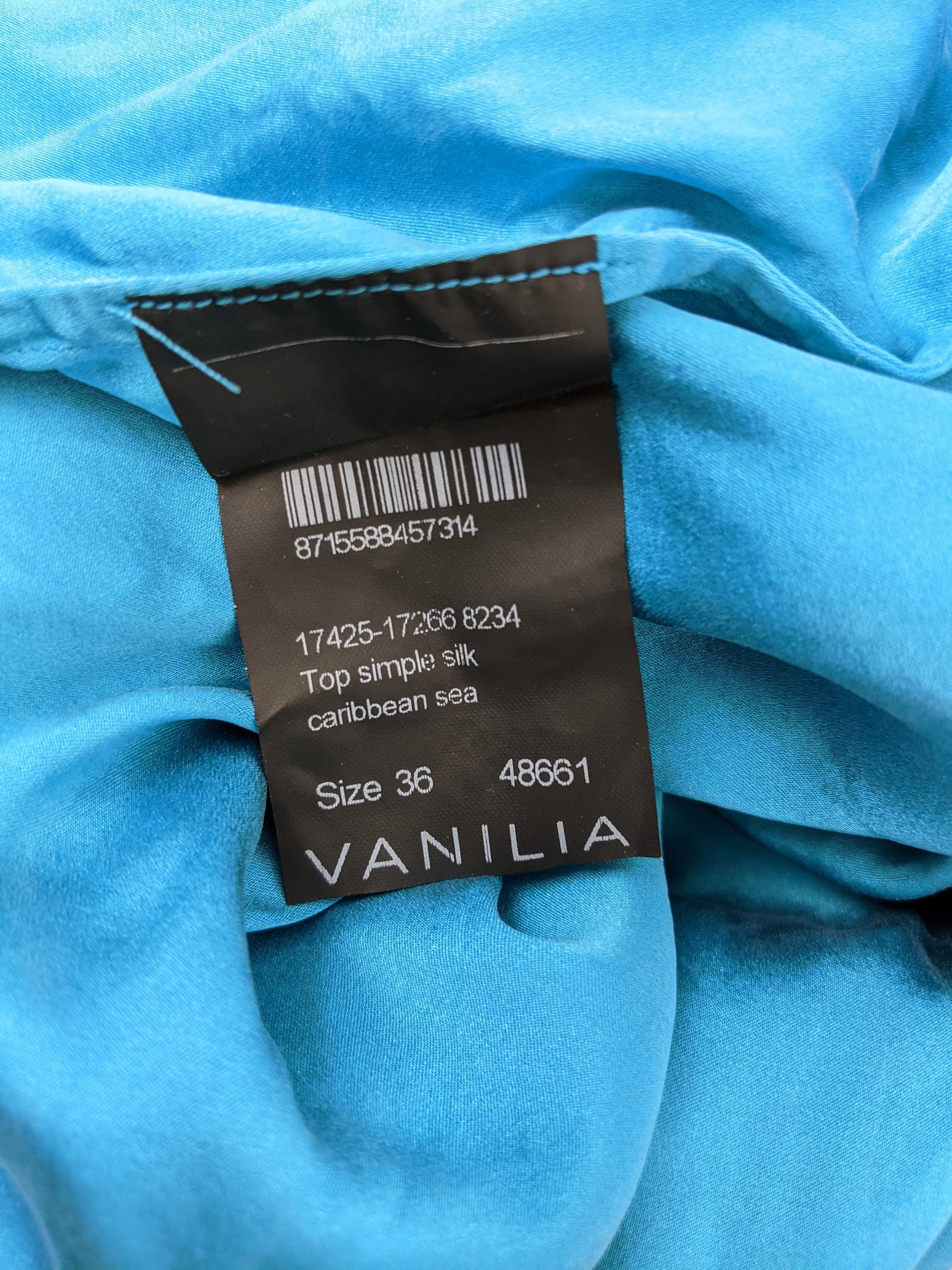Label showing details of Vanilia Caribbean Sea Blue Silk Top