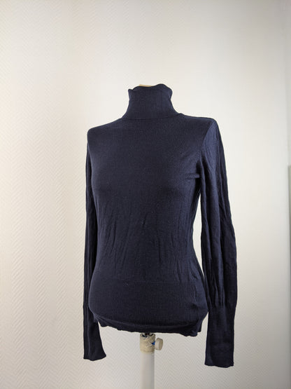 Front view of black turtleneck sweater