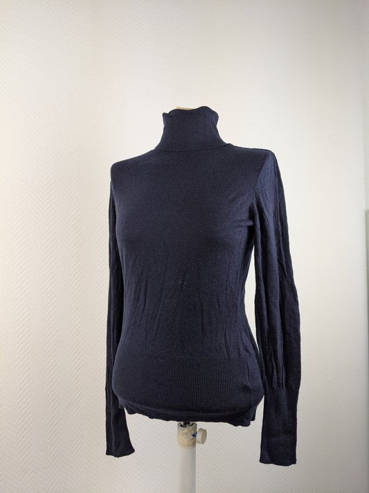 Front view of black turtleneck sweater