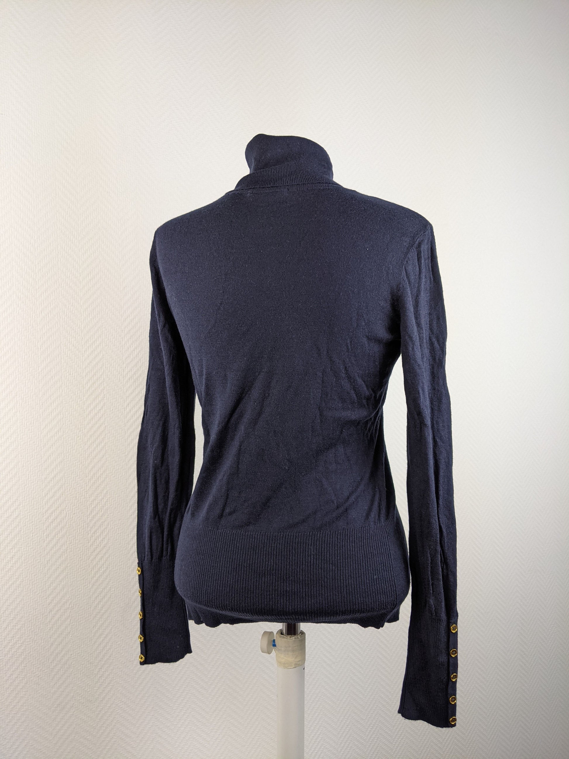 Back view of black turtleneck sweater