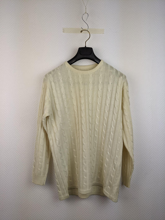 Front view of cream cable knit sweater