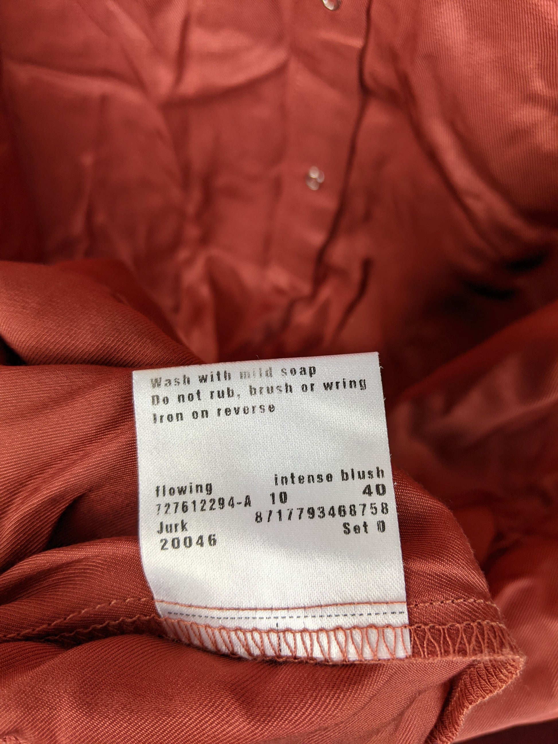 Care tag on Vanilia intense blush tunic dress