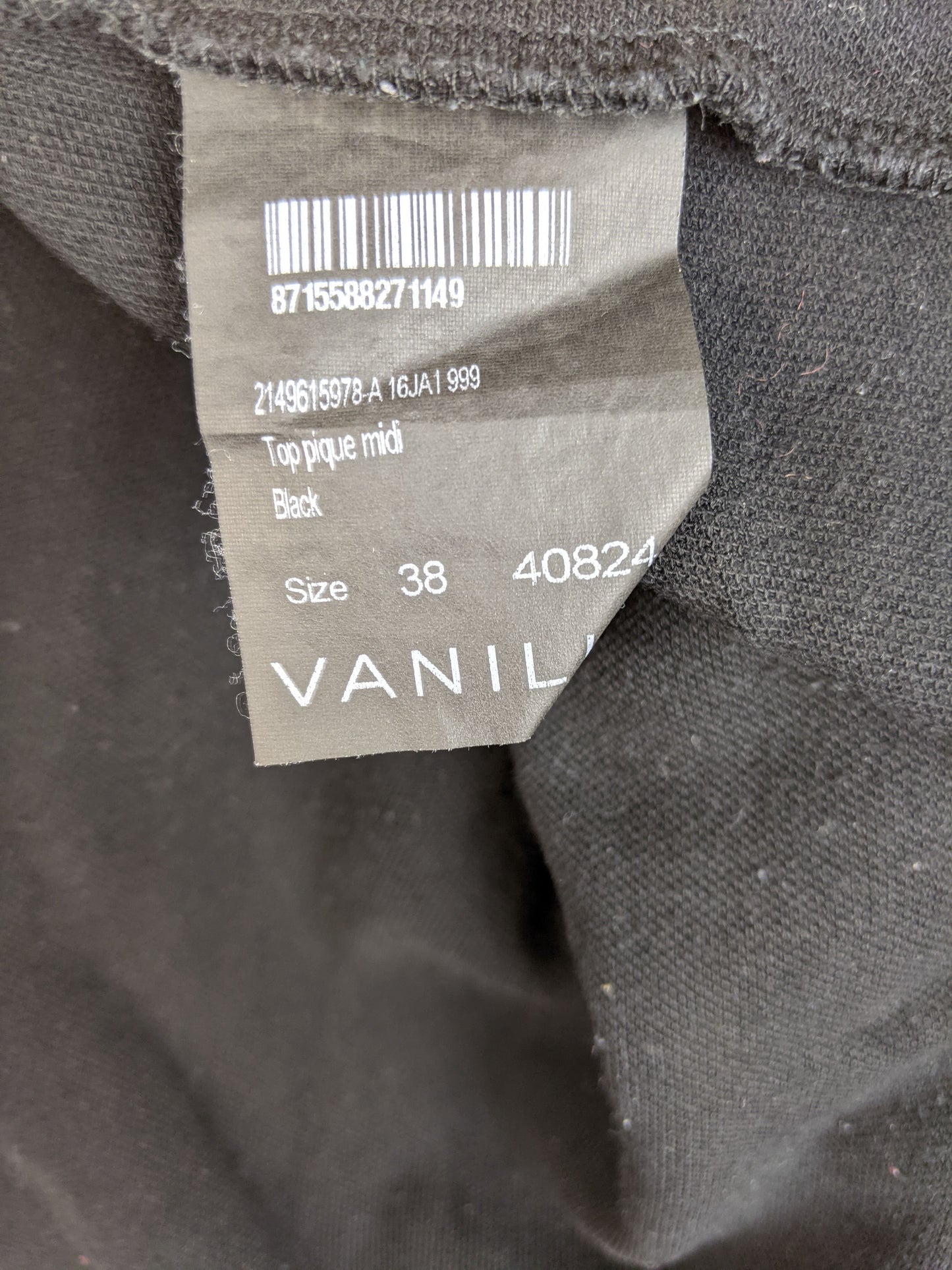 Close-up of clothing tag showing size and details