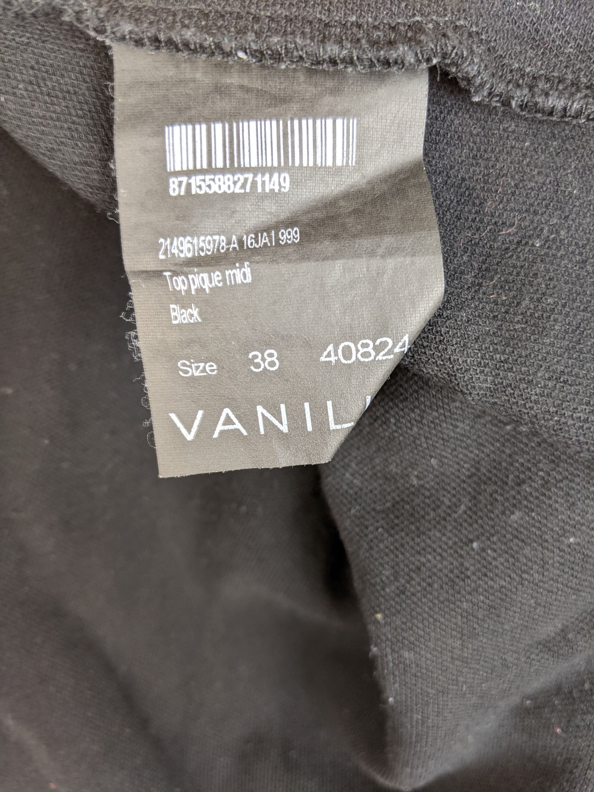 Close-up of clothing tag showing size and details