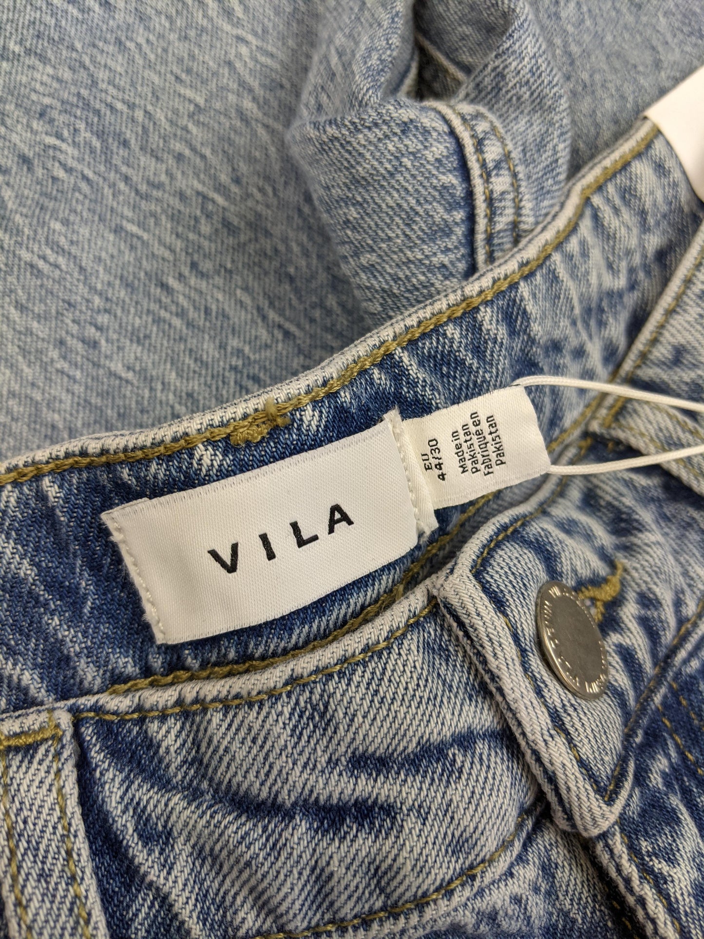 Close-up of VILA label on jeans