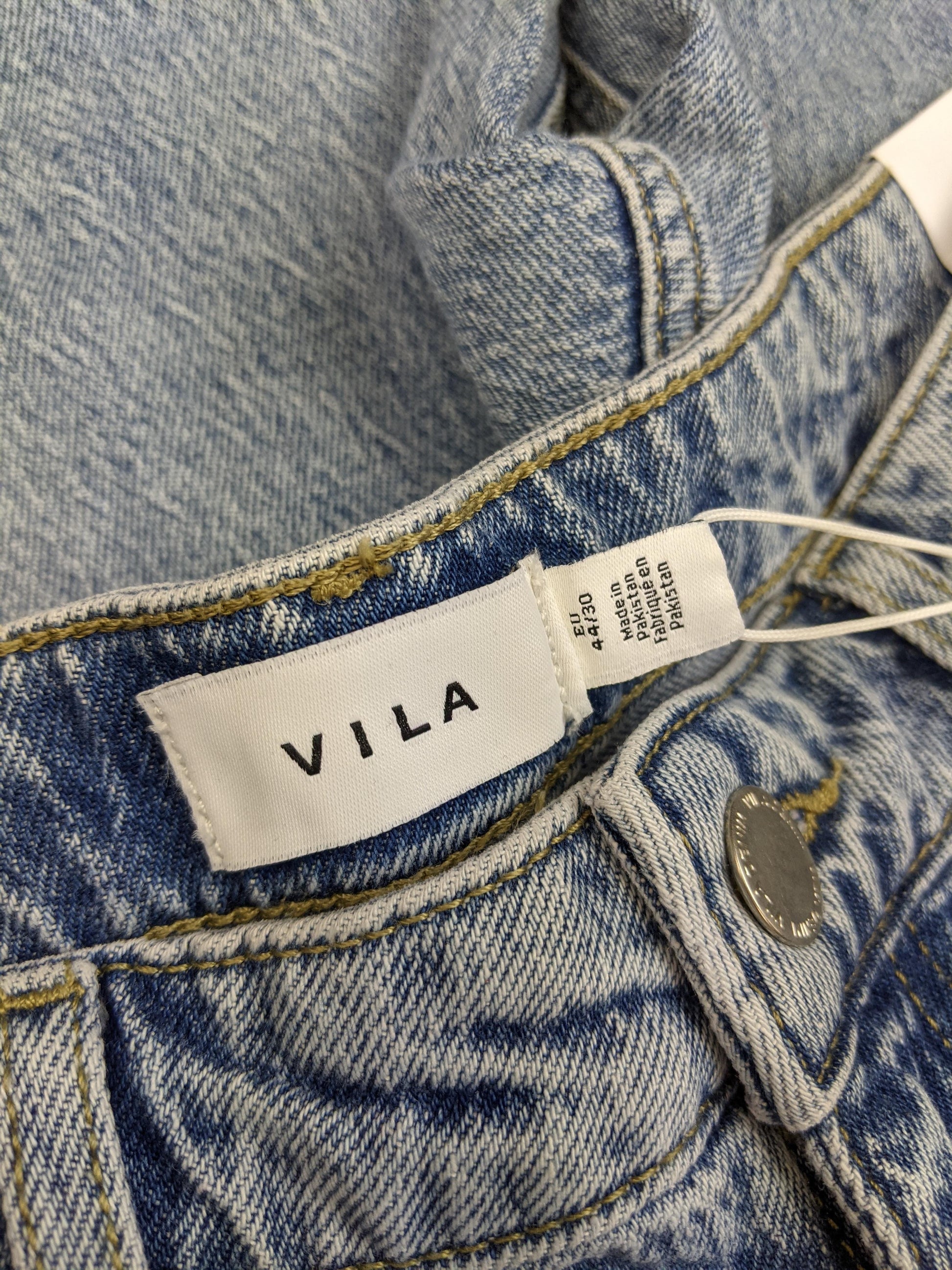 Close-up of VILA label on jeans