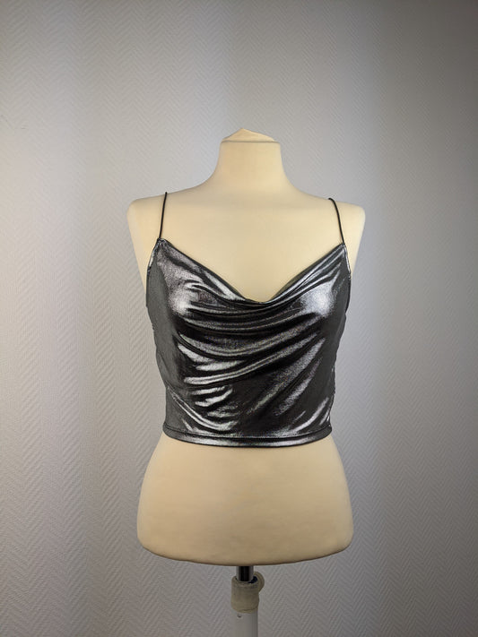 Front view of shiny silver cami top on mannequin