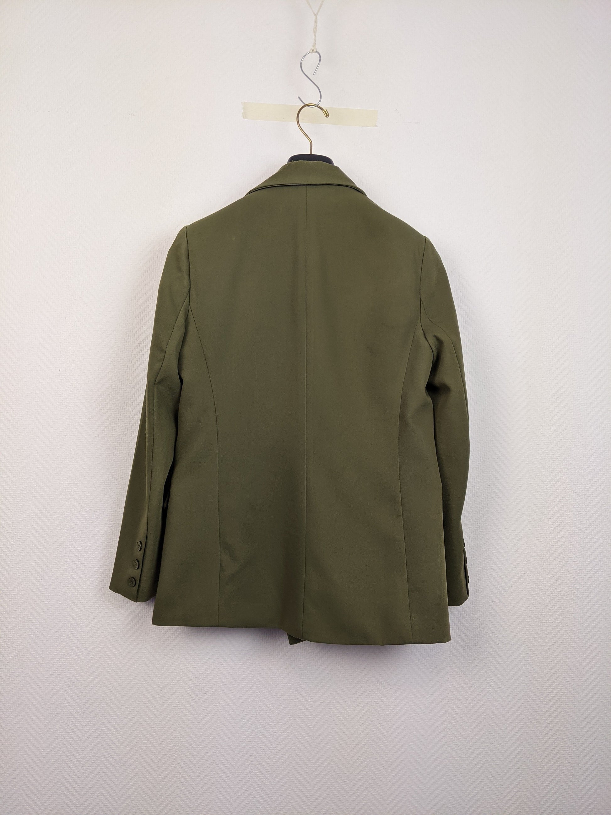 Back view of an olive green blazer on a hanger
