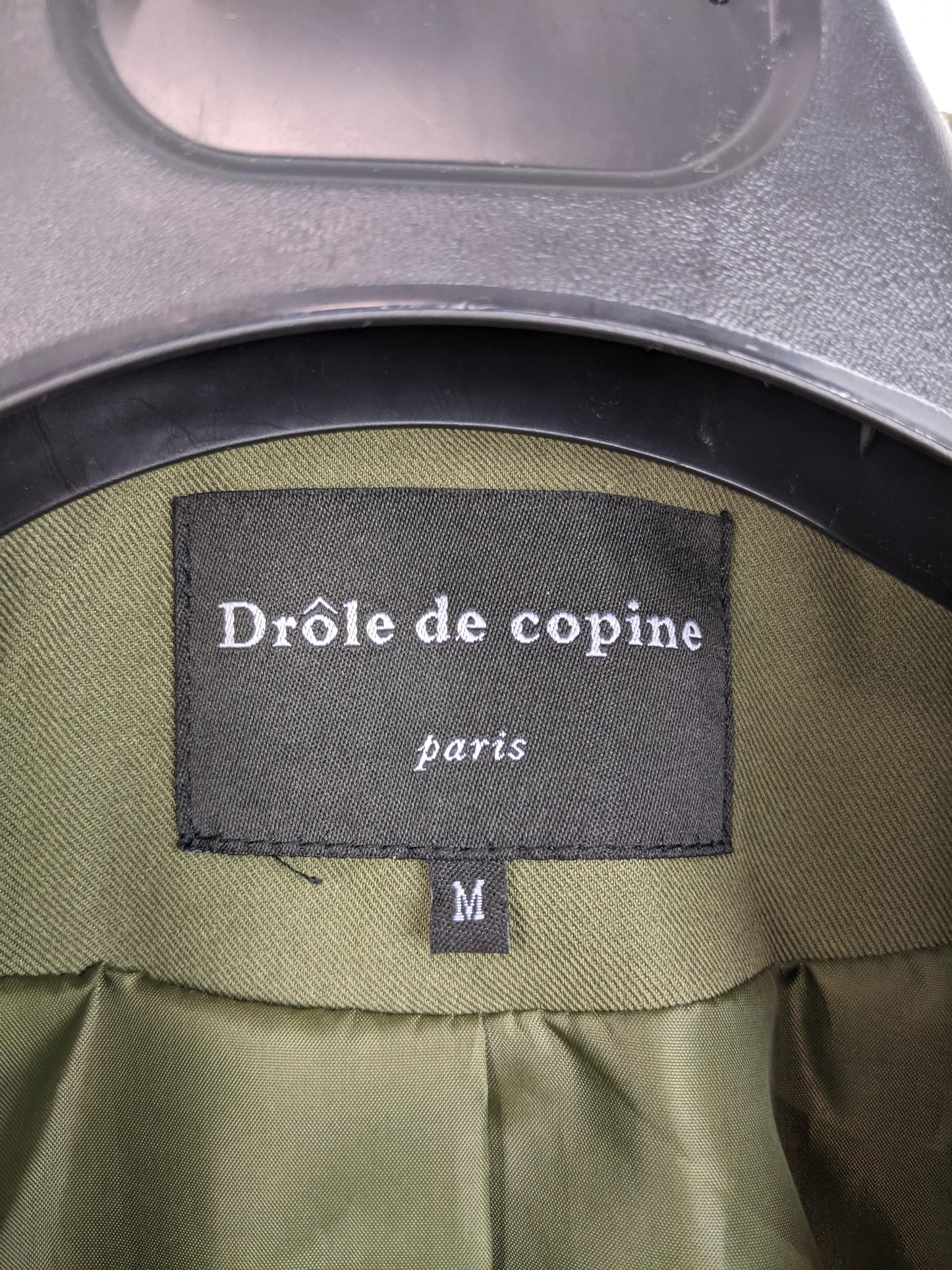 Close-up of the Drôle de Copine brand label inside the blazer