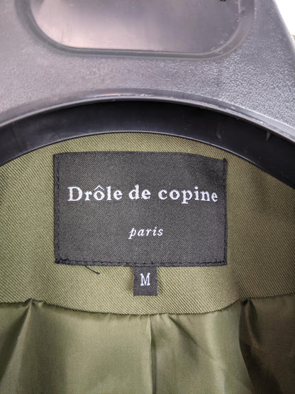Close-up of the Drôle de Copine brand label inside the blazer