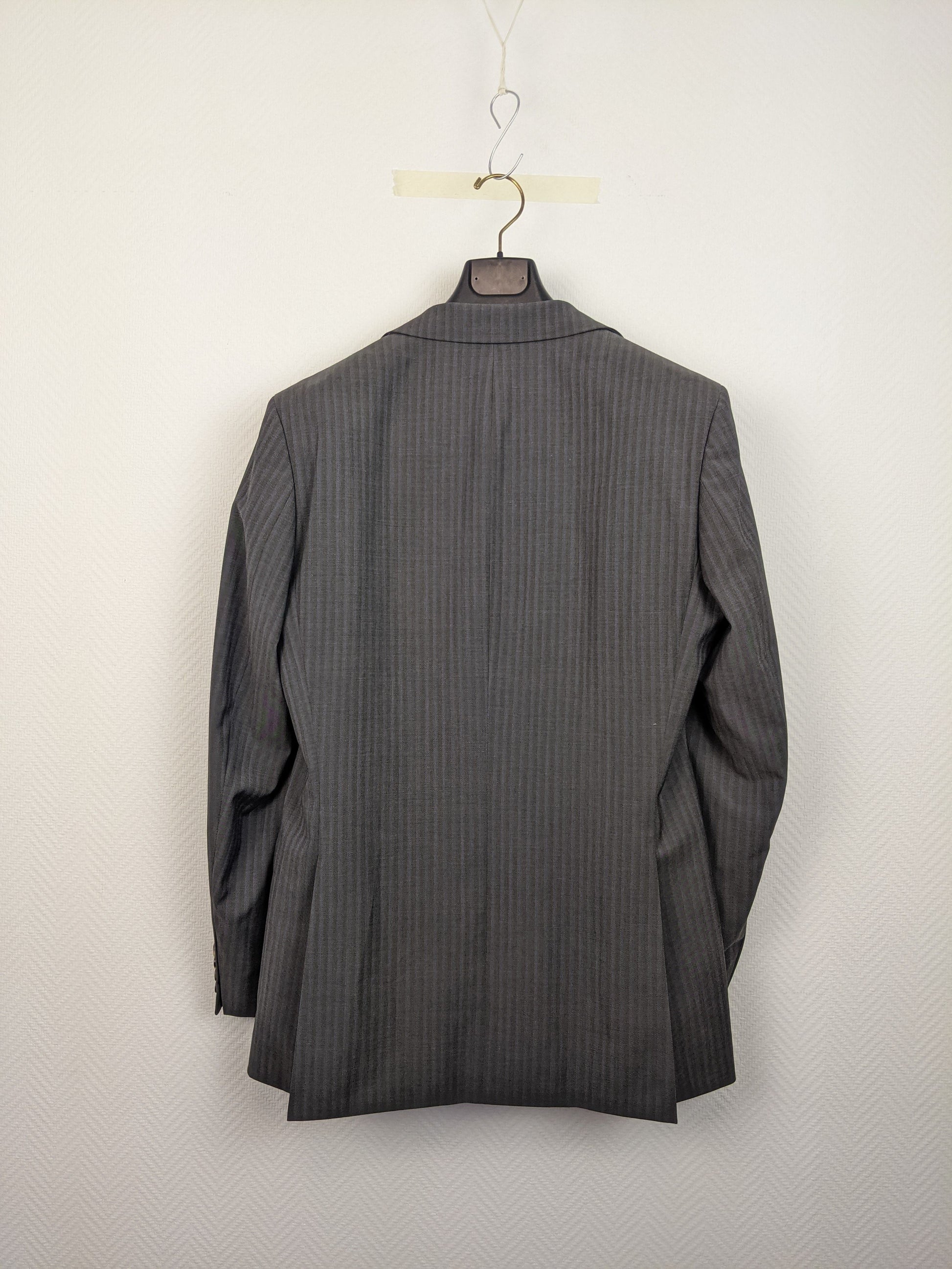 Back view of gray pinstripe suit jacket