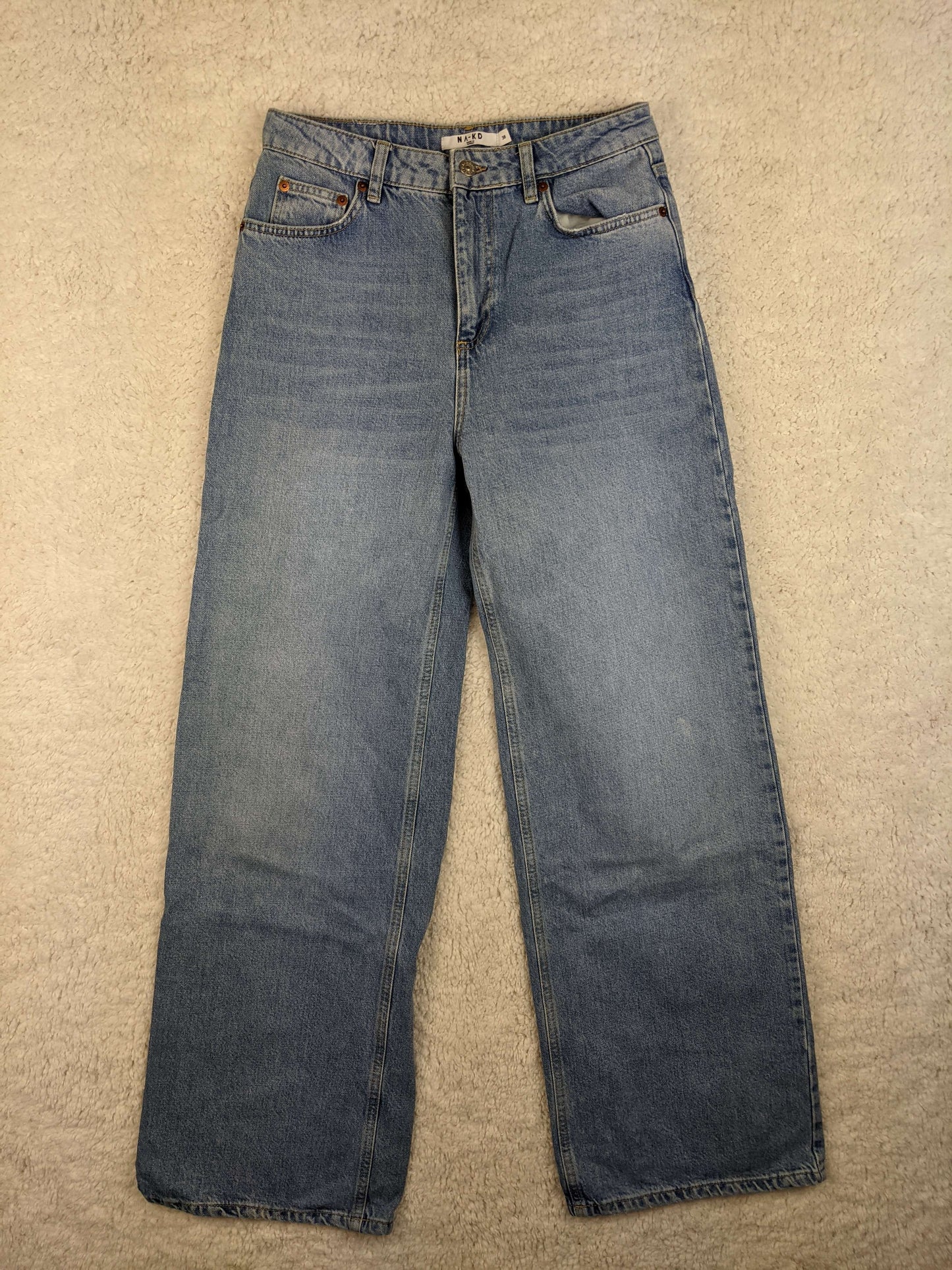 Front view of NA-KD blue jeans