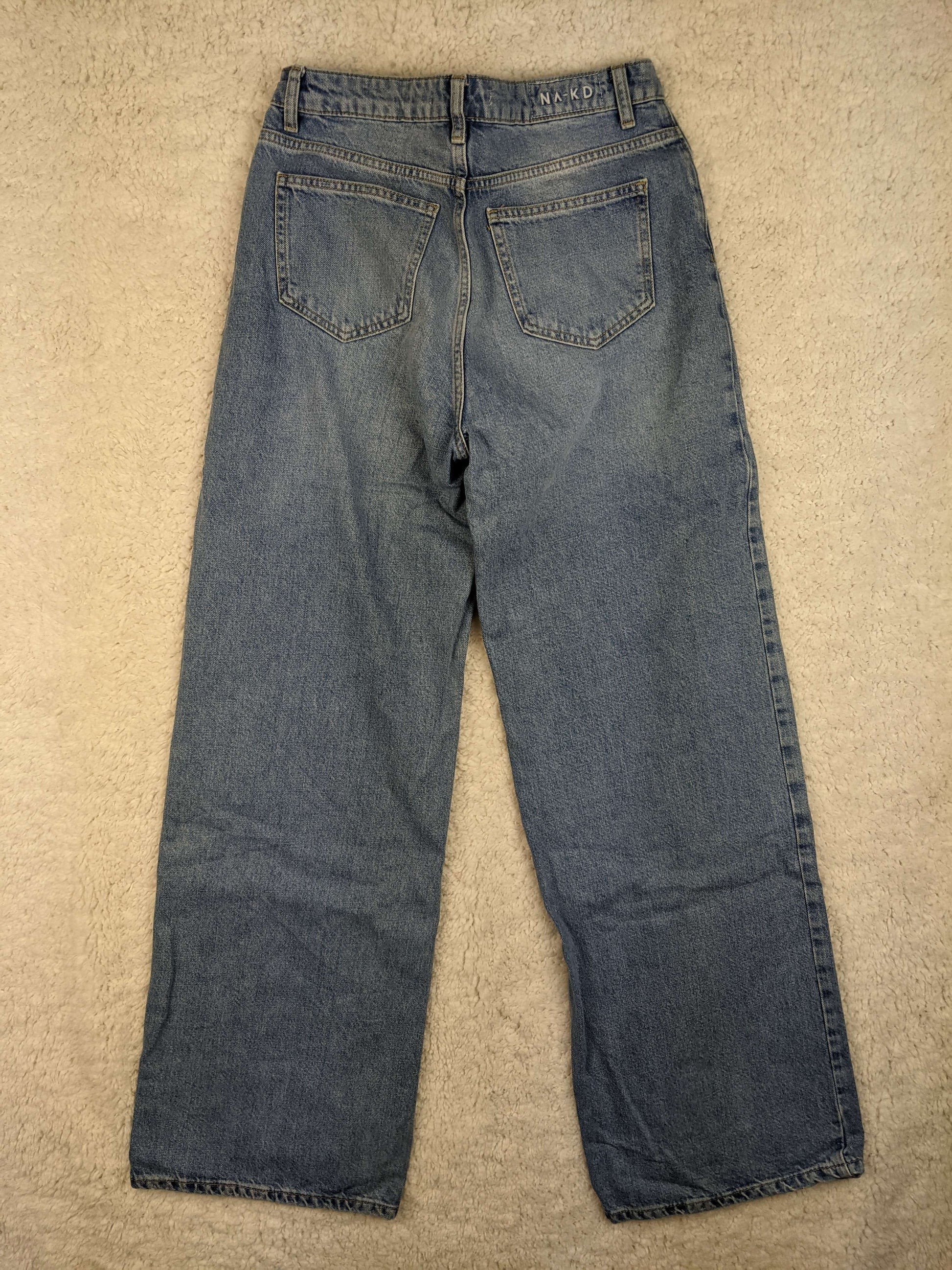 Back view of NA-KD blue jeans