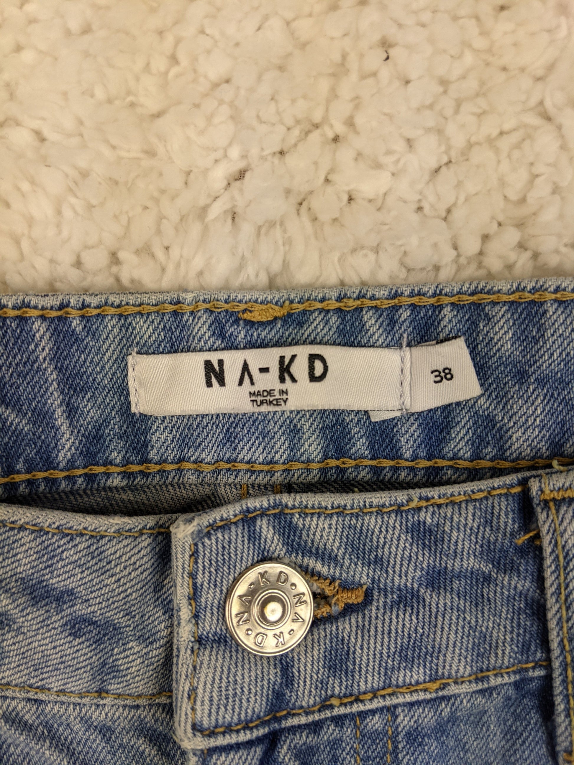 Close-up of NA-KD jeans label