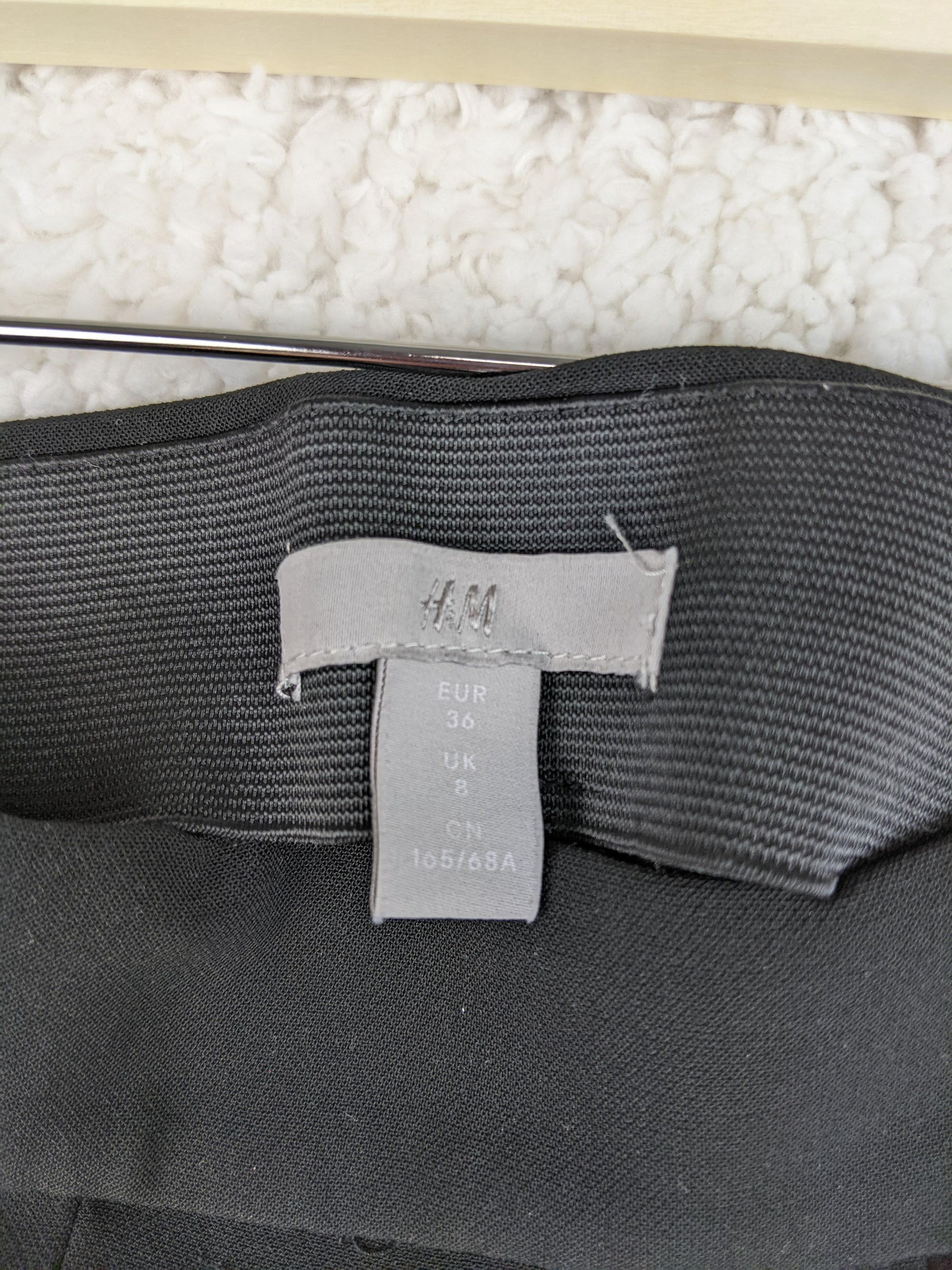 Size label of black shorts showing EUR 36