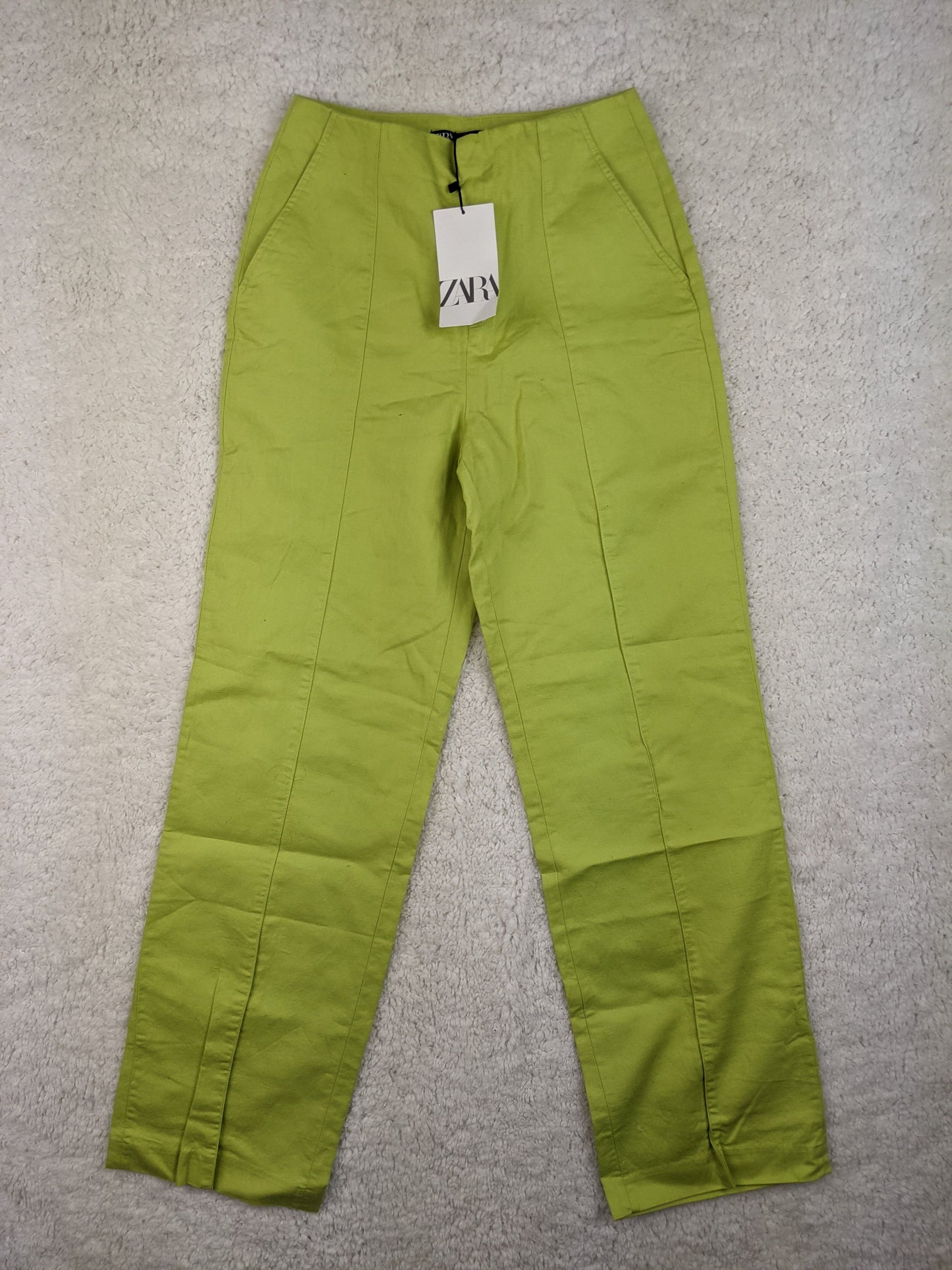 Front view of Zara lime green high-waisted pants
