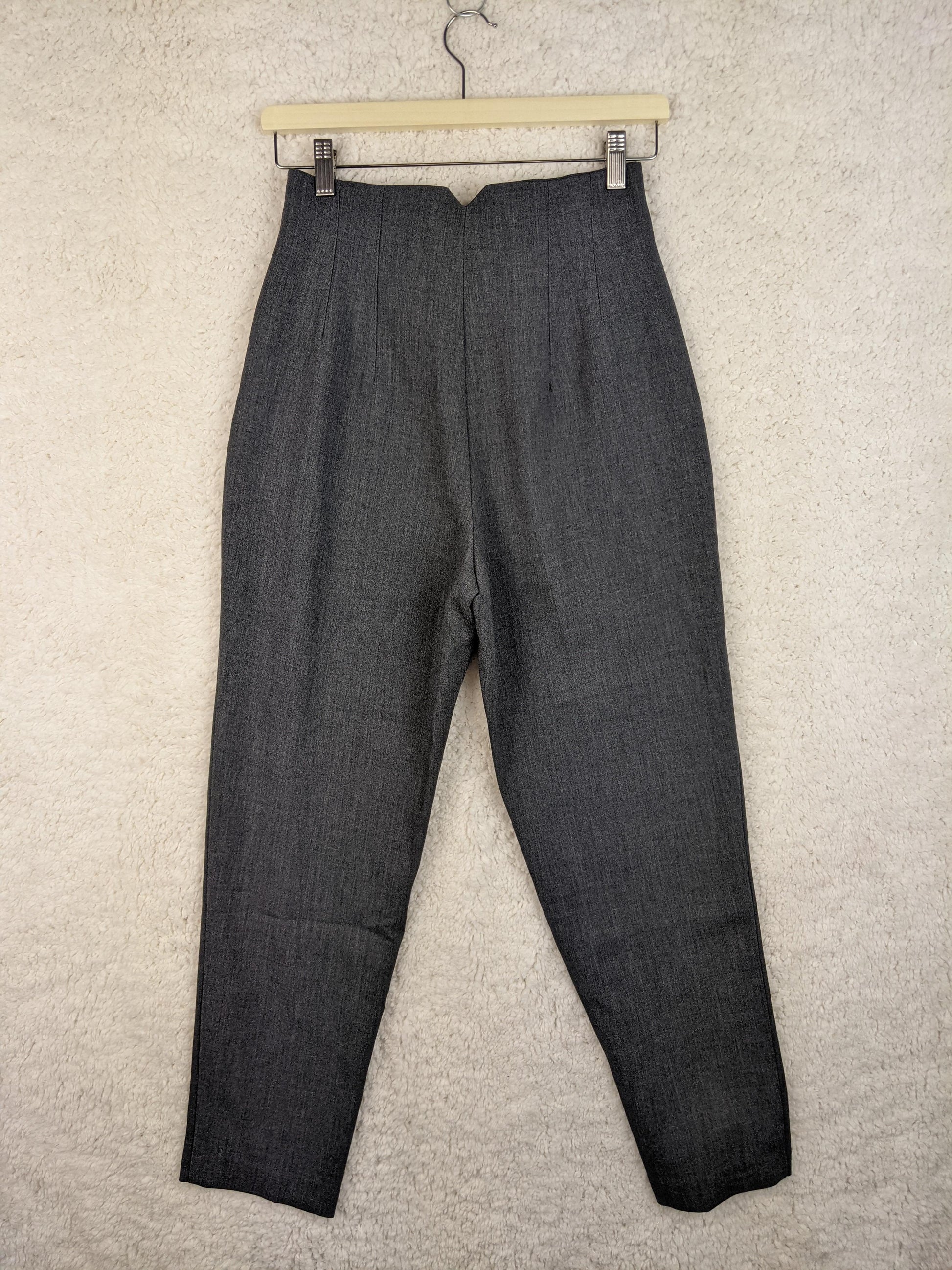 Back view of grey trousers on hanger