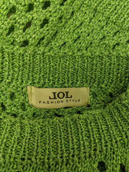 Close-up of JOL brand label on green crochet top