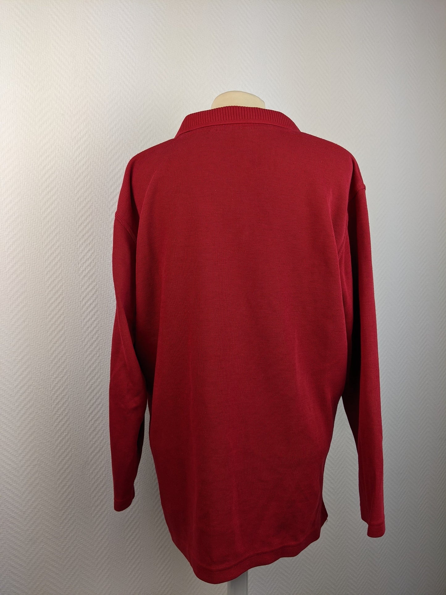 Back view of red long-sleeve sweater