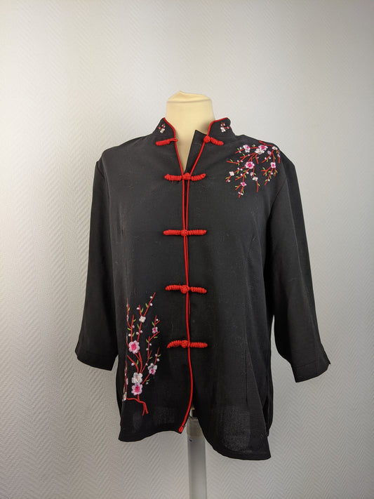Front view of black Chinese style shirt with embroidery