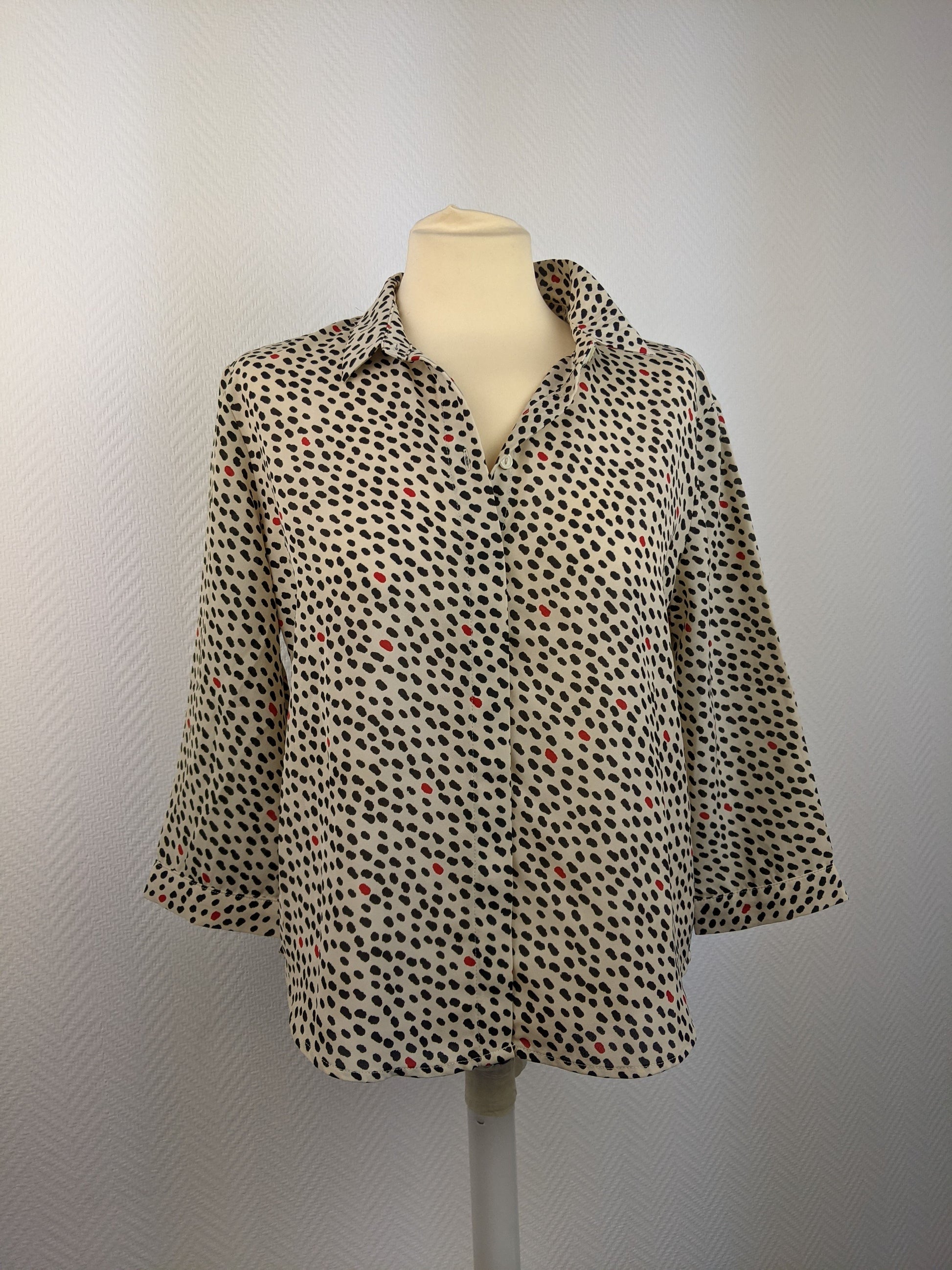 Front view of Monki polka dot button-up shirt