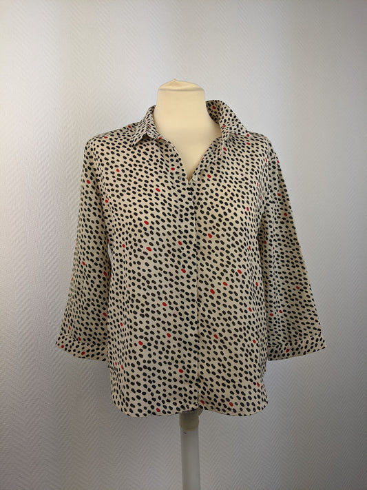 Front view of Monki polka dot button-up shirt