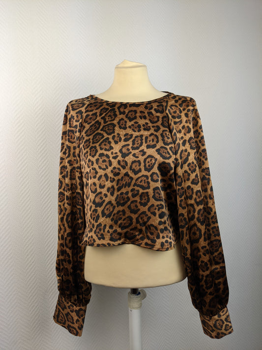 Front view of leopard print satin blouse on mannequin