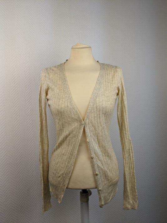 Front view of beige ribbed cardigan