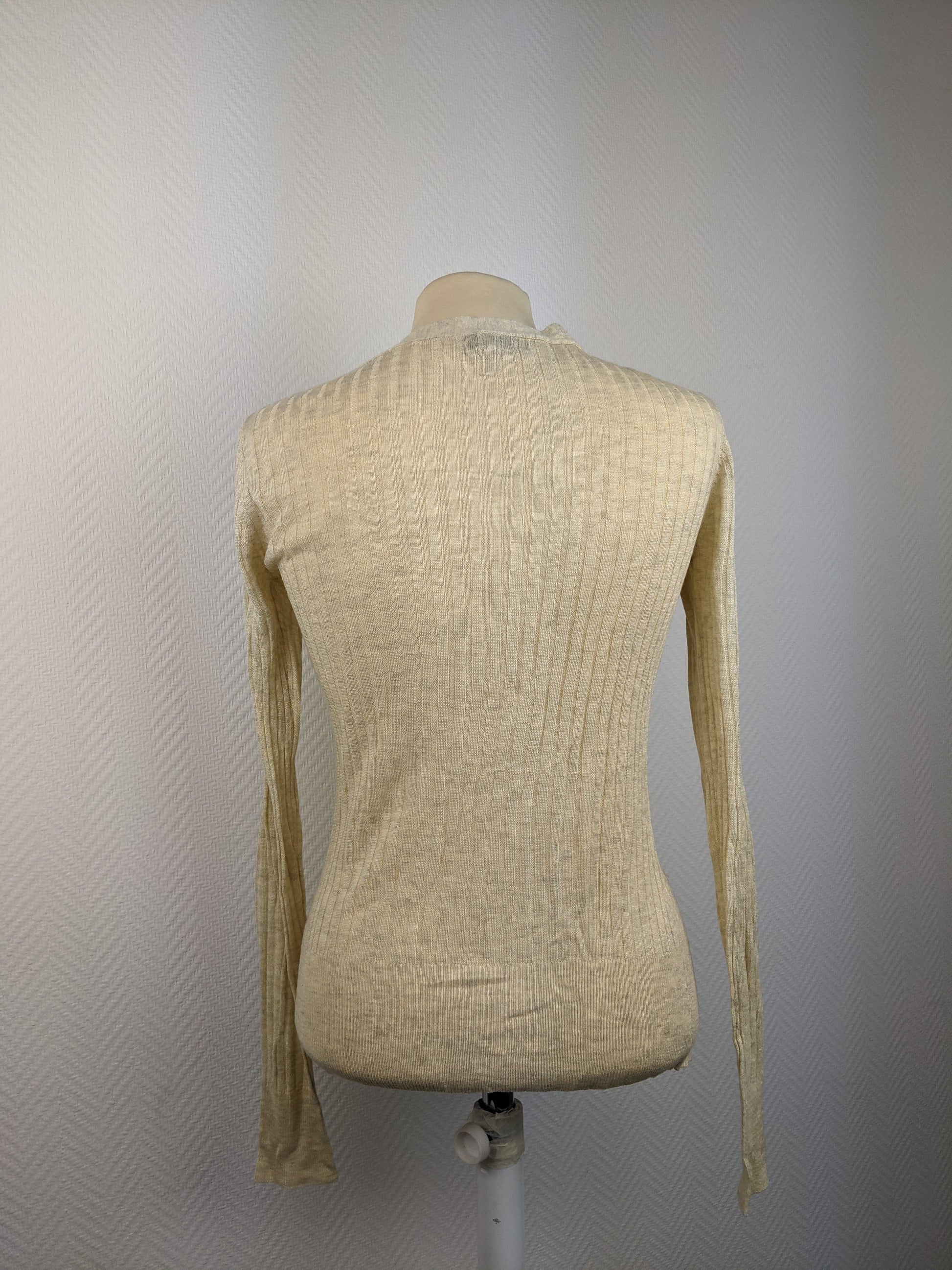 Back view of beige ribbed cardigan