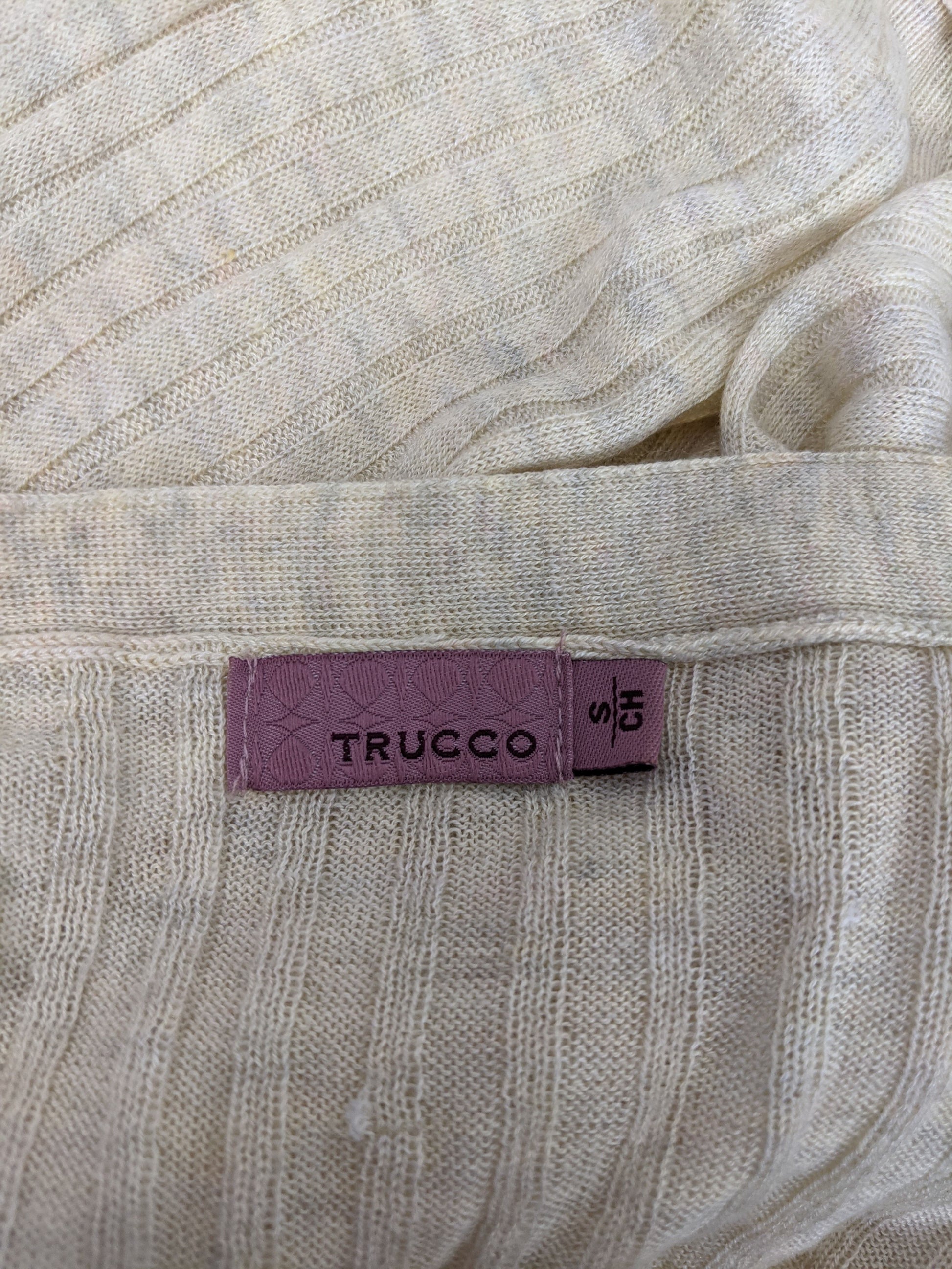 Close-up of Trucco label on cardigan