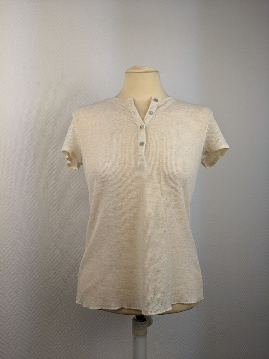 Front view of a beige short sleeve button-up top