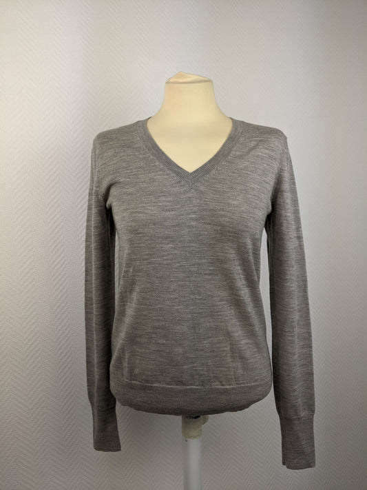 Front of grey V-neck sweater