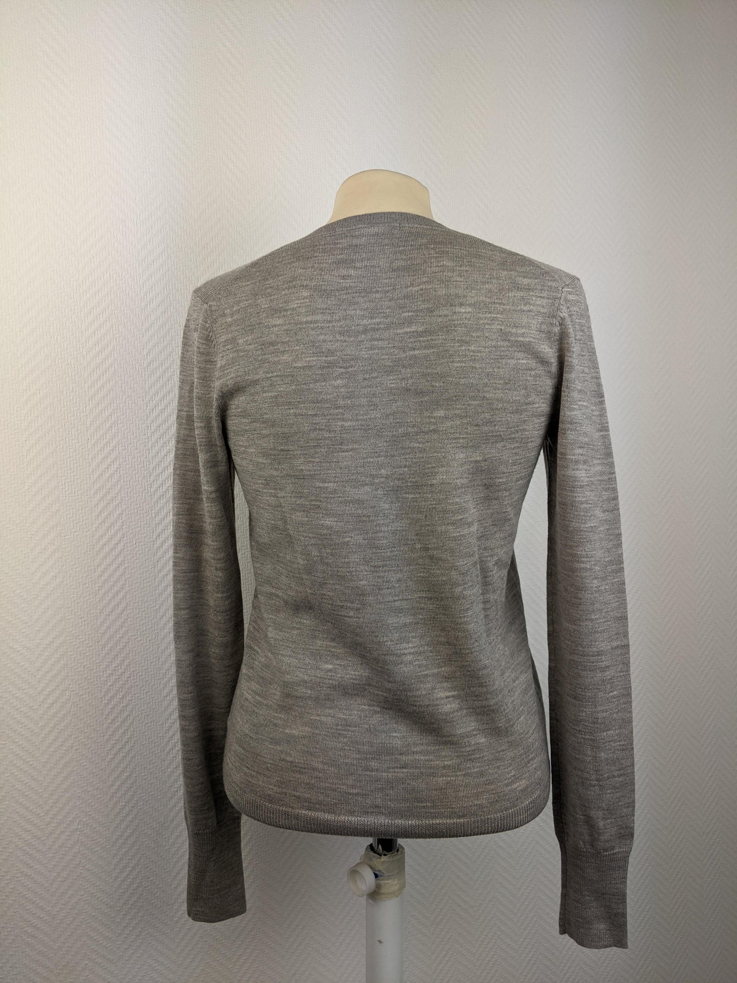 Back of grey V-neck sweater