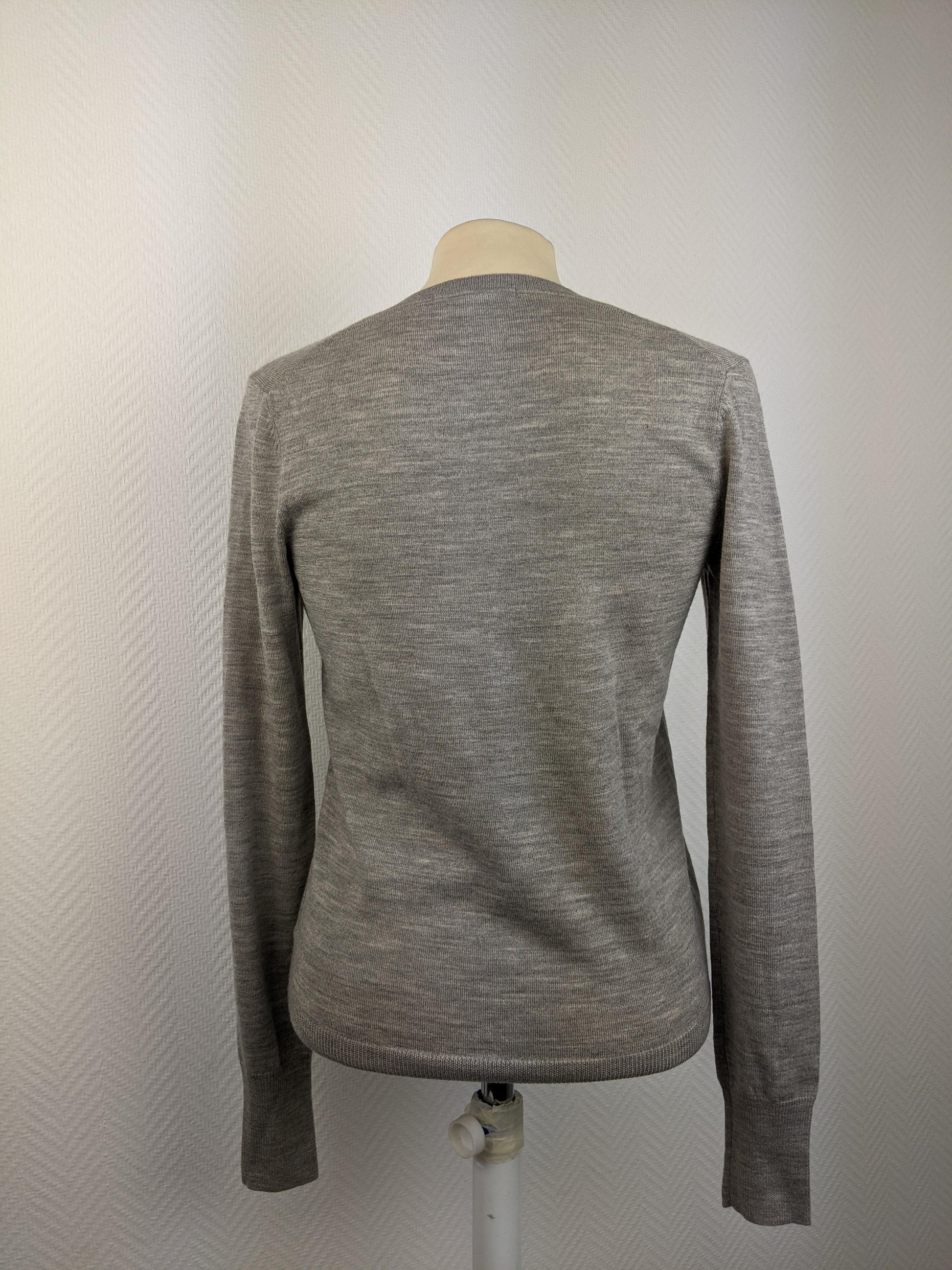 Back of grey V-neck sweater