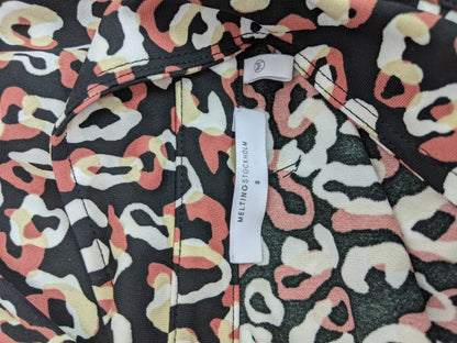 Close-up of label on leopard print blouse